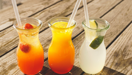 plastic straws in drinking glasses filled will juice