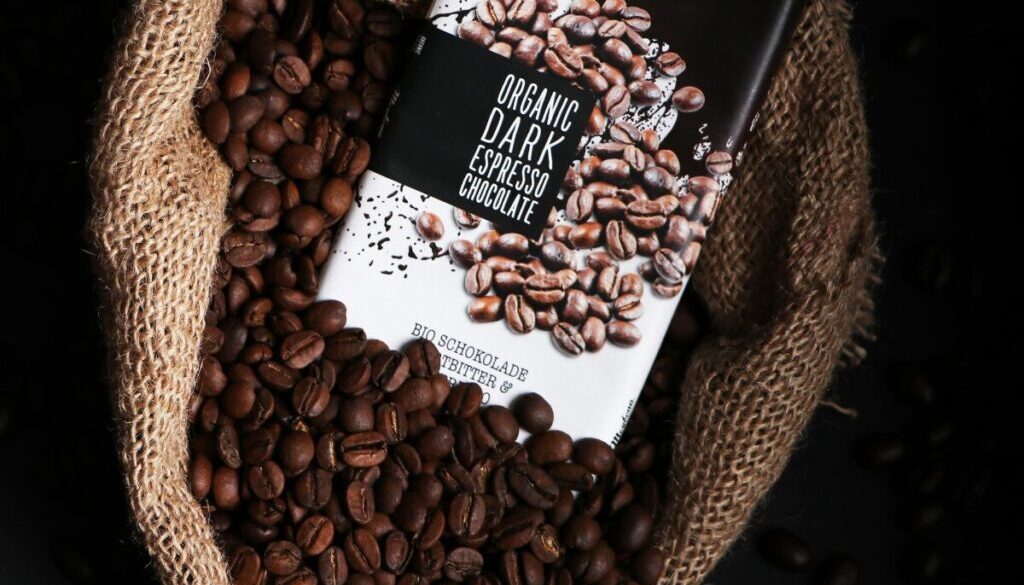 Cocoa beans in a bag with a chocolate bar