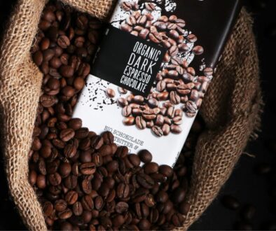 Cocoa beans in a bag with a chocolate bar