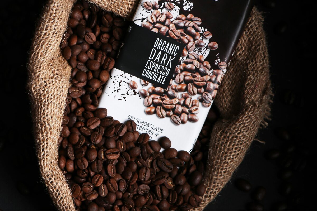 Cocoa beans in a bag with a chocolate bar
