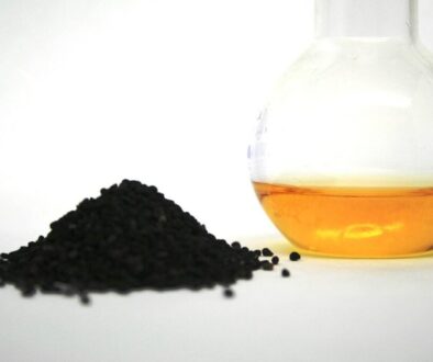 Solid plastic in a pile next to a jar of liquid.