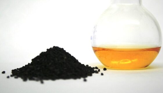 Solid plastic in a pile next to a jar of liquid.